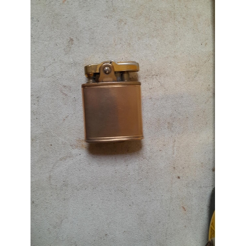 189 - Ronson Gents pocket lighter with 9 ct gold removable jacket which weighs 9 . 8 g