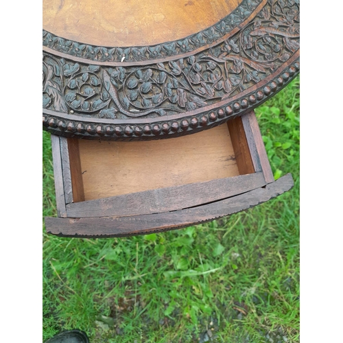 241 - 19th century Burmese rosewood profusely carved table on single pedestal with four drawers