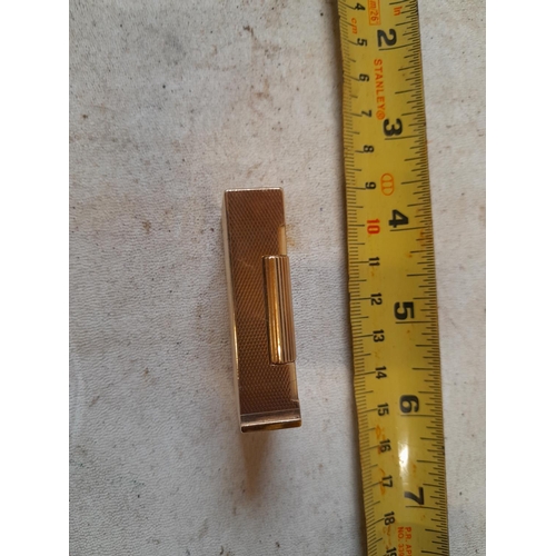 242 - 9 ct solid gold petrol lighter with engine turned decoration  ADB mark (Alfred Dunhill Brothers) and... 