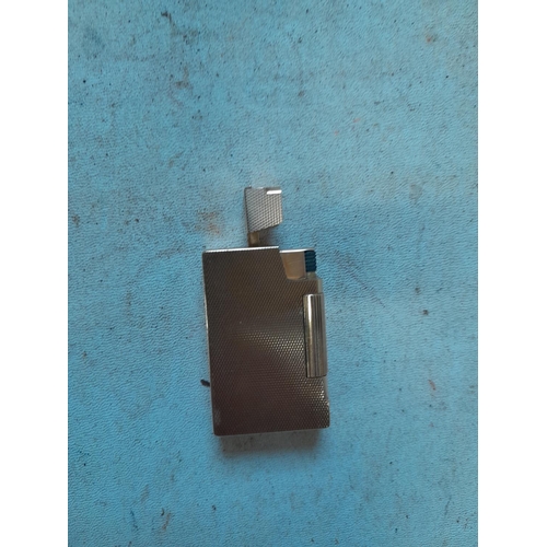 242 - 9 ct solid gold petrol lighter with engine turned decoration  ADB mark (Alfred Dunhill Brothers) and... 