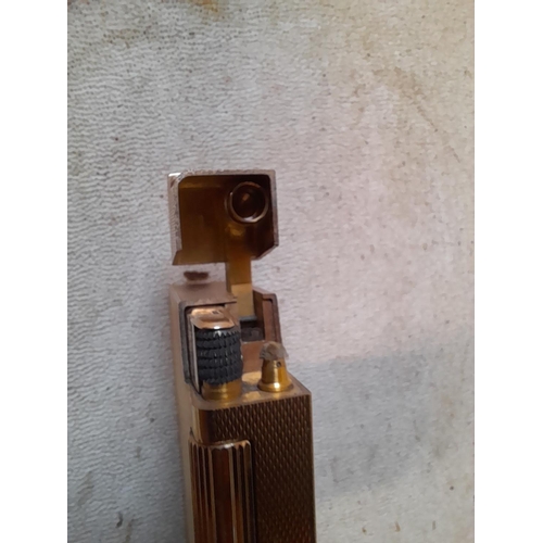 242 - 9 ct solid gold petrol lighter with engine turned decoration  ADB mark (Alfred Dunhill Brothers) and... 