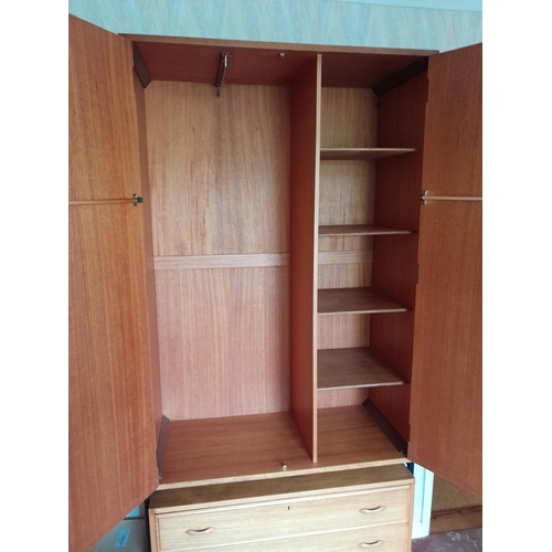 61 - Vintage Staples Teak modular units (Heals interest) comprising of : chest of drawers, wardrobe, shel... 