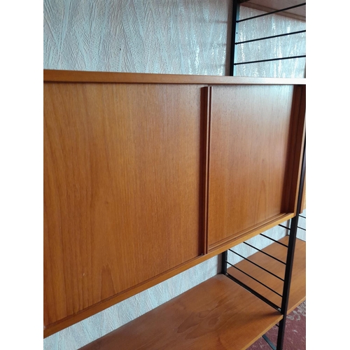 62 - Vintage Staples Teak modular units (Heals interest) comprising of : five x cabinets and various shel... 