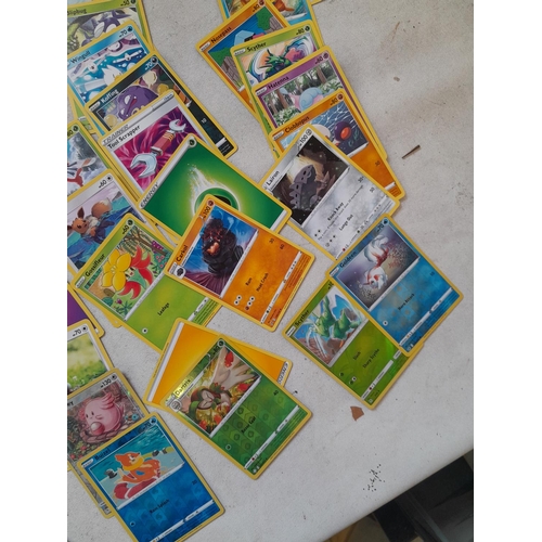 143 - Pokemon trading cards and tins