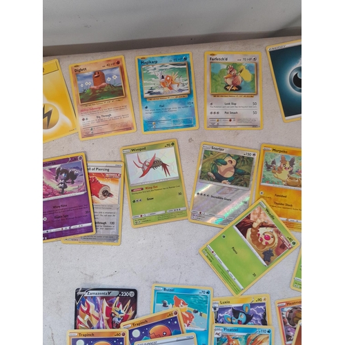 143 - Pokemon trading cards and tins