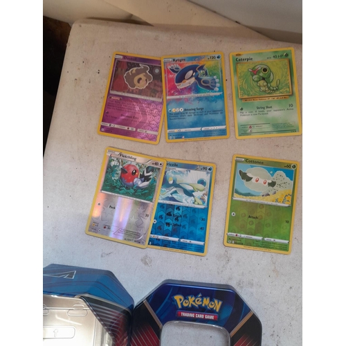 143 - Pokemon trading cards and tins