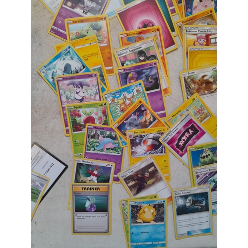 144 - Pokemon trading cards and tins