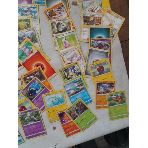 144 - Pokemon trading cards and tins