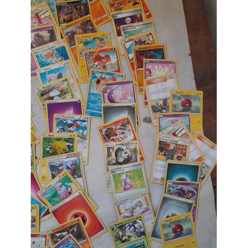 144 - Pokemon trading cards and tins