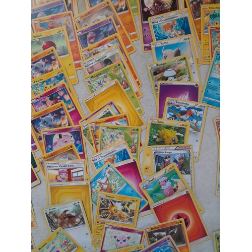 144 - Pokemon trading cards and tins