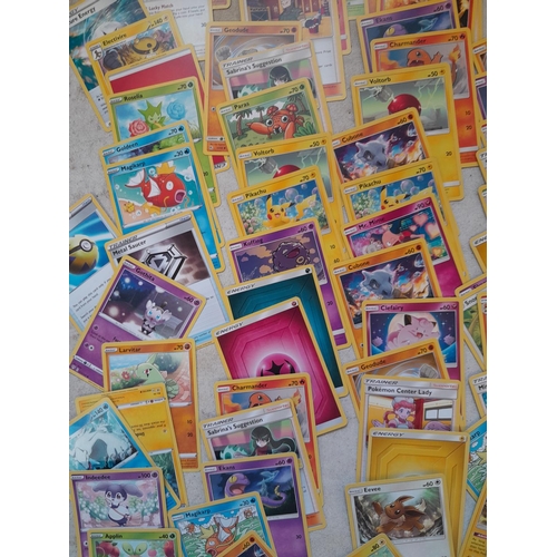 144 - Pokemon trading cards and tins