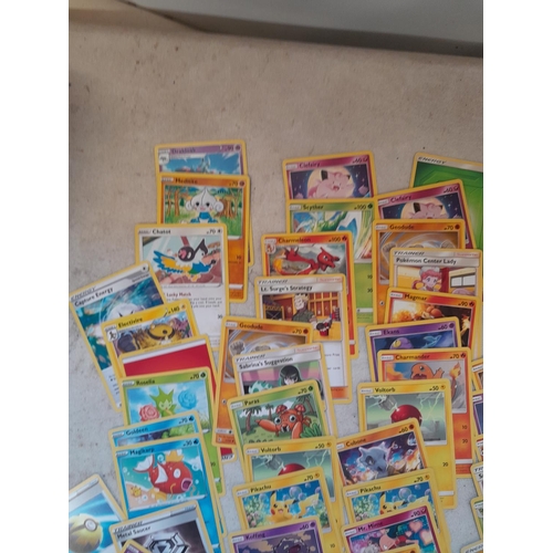 144 - Pokemon trading cards and tins