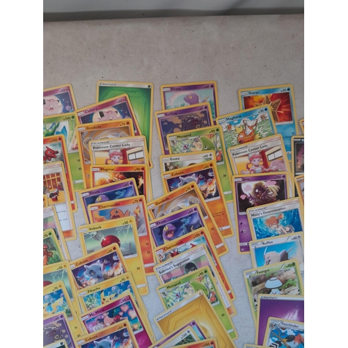 144 - Pokemon trading cards and tins