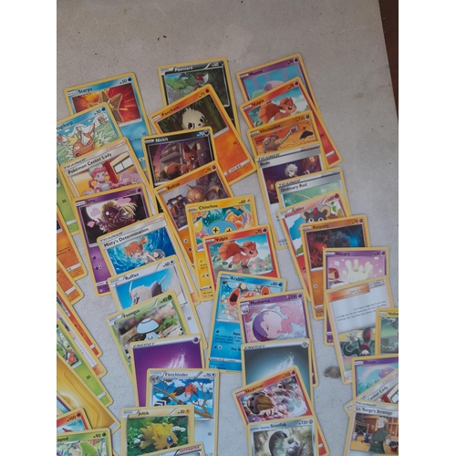 144 - Pokemon trading cards and tins