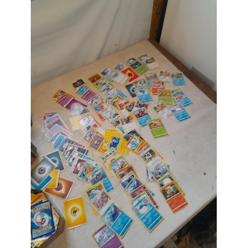 144 - Pokemon trading cards and tins