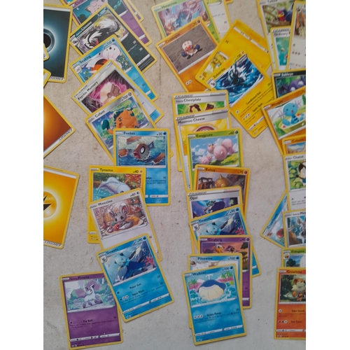 144 - Pokemon trading cards and tins