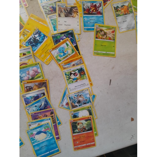 144 - Pokemon trading cards and tins