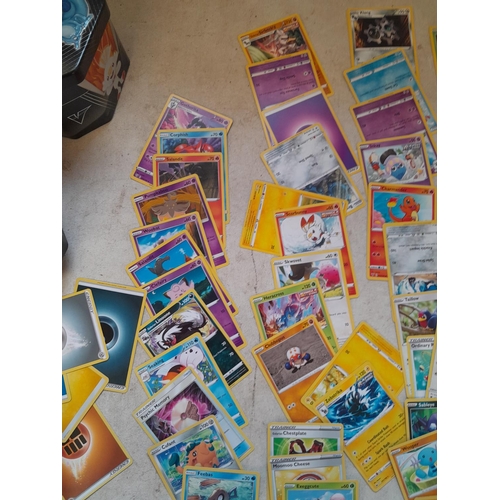 144 - Pokemon trading cards and tins