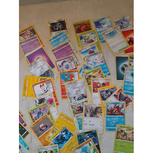 144 - Pokemon trading cards and tins