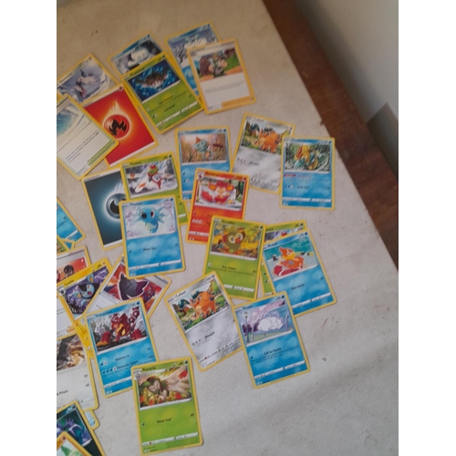 144 - Pokemon trading cards and tins