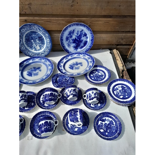 173 - Large array of blue and white china : Victorian flow blue plates, part tea set, some with damages ma... 