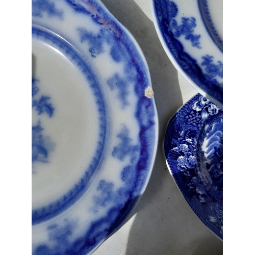 173 - Large array of blue and white china : Victorian flow blue plates, part tea set, some with damages ma... 