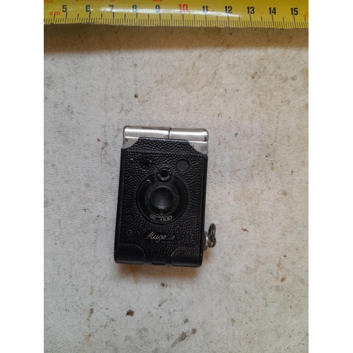 436 - Vintage Mugette camera pocket petrol lighter, note damage