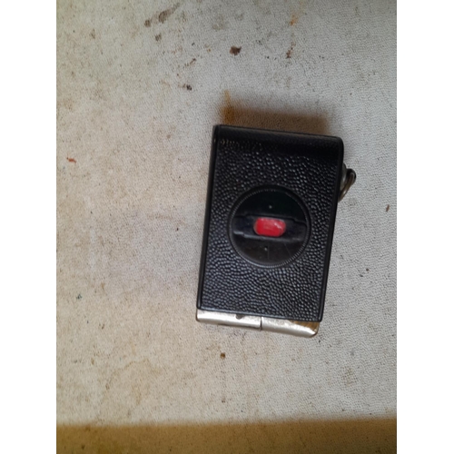 436 - Vintage Mugette camera pocket petrol lighter, note damage