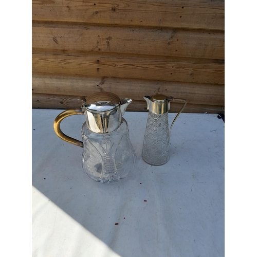 245 - 2 x silver plated and cut glass claret jugs