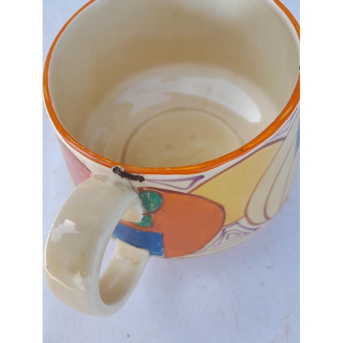 246 - Damaged Clarice Cliff Fantasque jug with stapled repair to handle