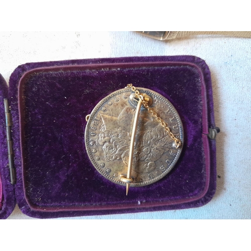 263 - Costume jewellery and USA 1890 Silver dollar with unmarked but tested mounts for a brooch with guard... 