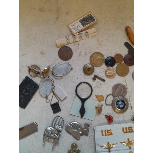 45 - Array of military interest cap badges, advertising penknife, pince nez etc.