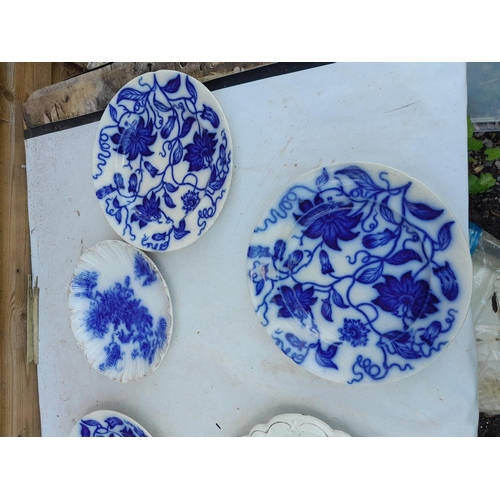 656 - Victorian flow blue and white plates, some crazing, some in good order