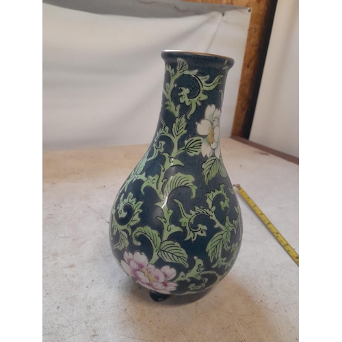 16 - Very interesting Chinese Famille Rose vase of baluster form terminating on tripod feet, with dark gr... 