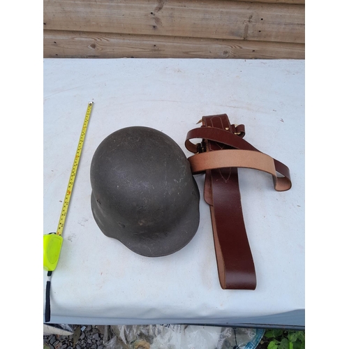 59 - German World War II era field helmet