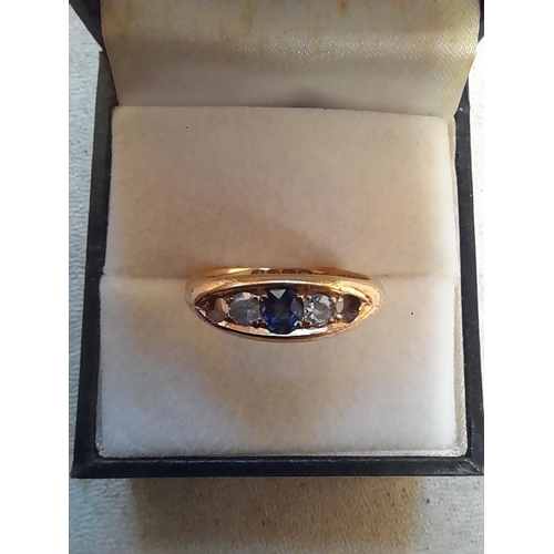 285 - 18 ct gold ring set with ruby, diamonds and sapphire, note one stone missing , size L/M4.1 g