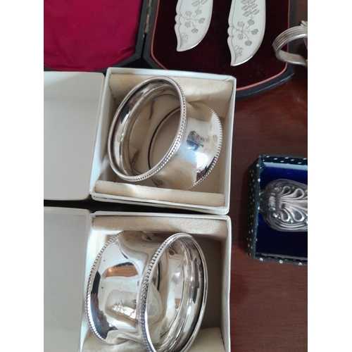 297 - 2 x silver  serviette rings, 2 x silver tea spoons, plated salts, silver handled knife etc.