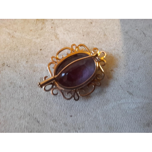 331 - Unmarked 9 ct gold mounted brooch set with amethyst