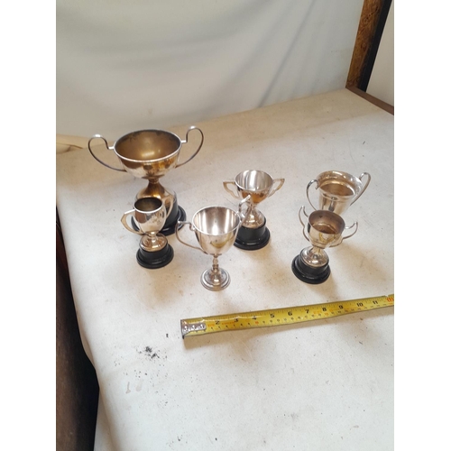 514 - Assorted size silver plated trophies