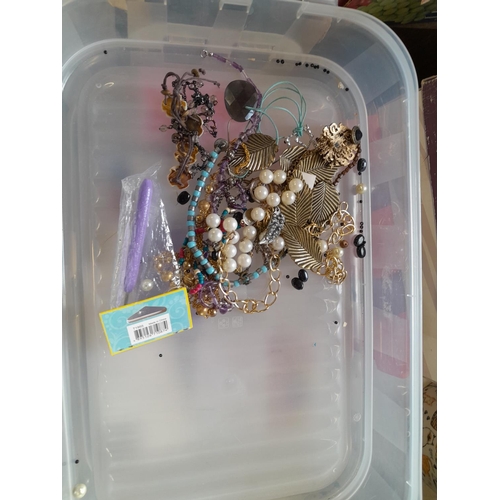 73 - Costume jewellery in a tiered plastic carrier