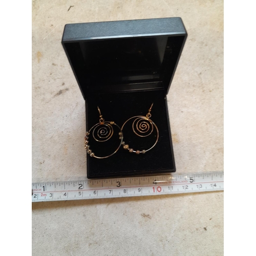 83 - Pair of silver spiral earrings in presentation box