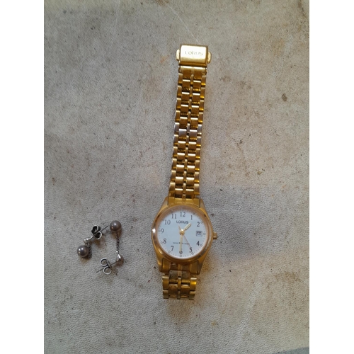 110 - Silver earring and Lorus watch