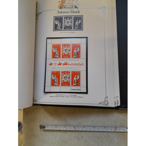 120 - Stamps :  25th Anniversary of the Coronation Commemorative stamp albums, 2 x sparsely filled albums ... 