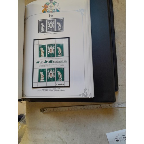 120 - Stamps :  25th Anniversary of the Coronation Commemorative stamp albums, 2 x sparsely filled albums ... 