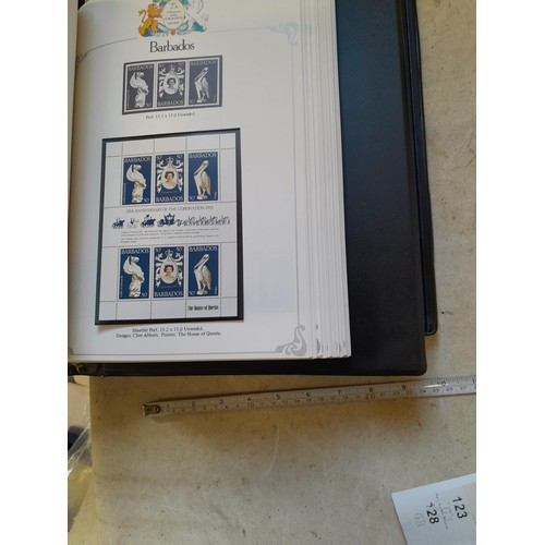 120 - Stamps :  25th Anniversary of the Coronation Commemorative stamp albums, 2 x sparsely filled albums ... 