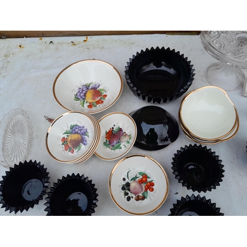 221 - Decorative china and glassware : black glass dishes, cream and black pottery bowls, crested ware