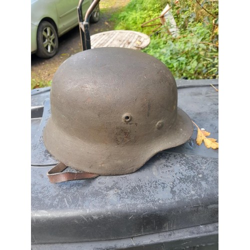 59 - German World War II era field helmet