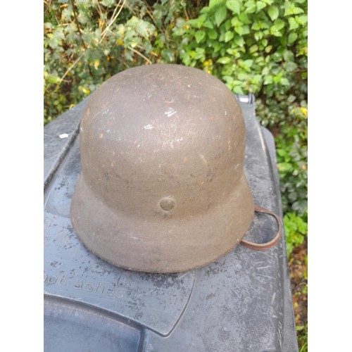 59 - German World War II era field helmet