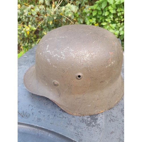 59 - German World War II era field helmet