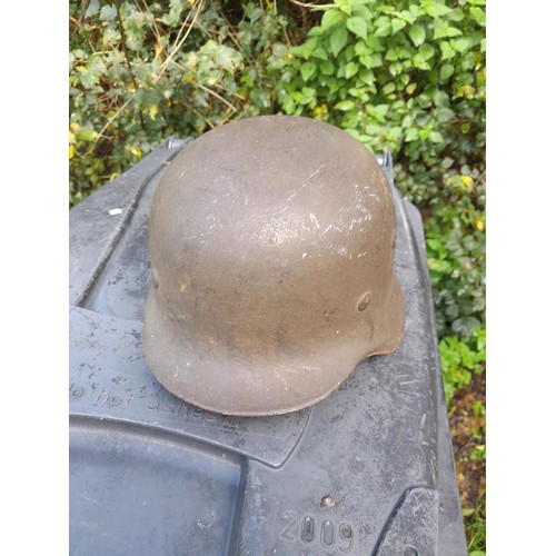 59 - German World War II era field helmet